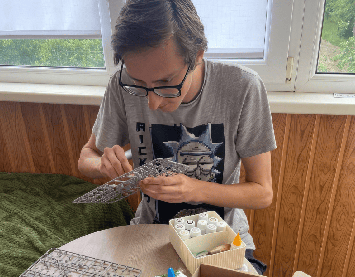 The boy creates a diorama of the military conflict in Vietnam