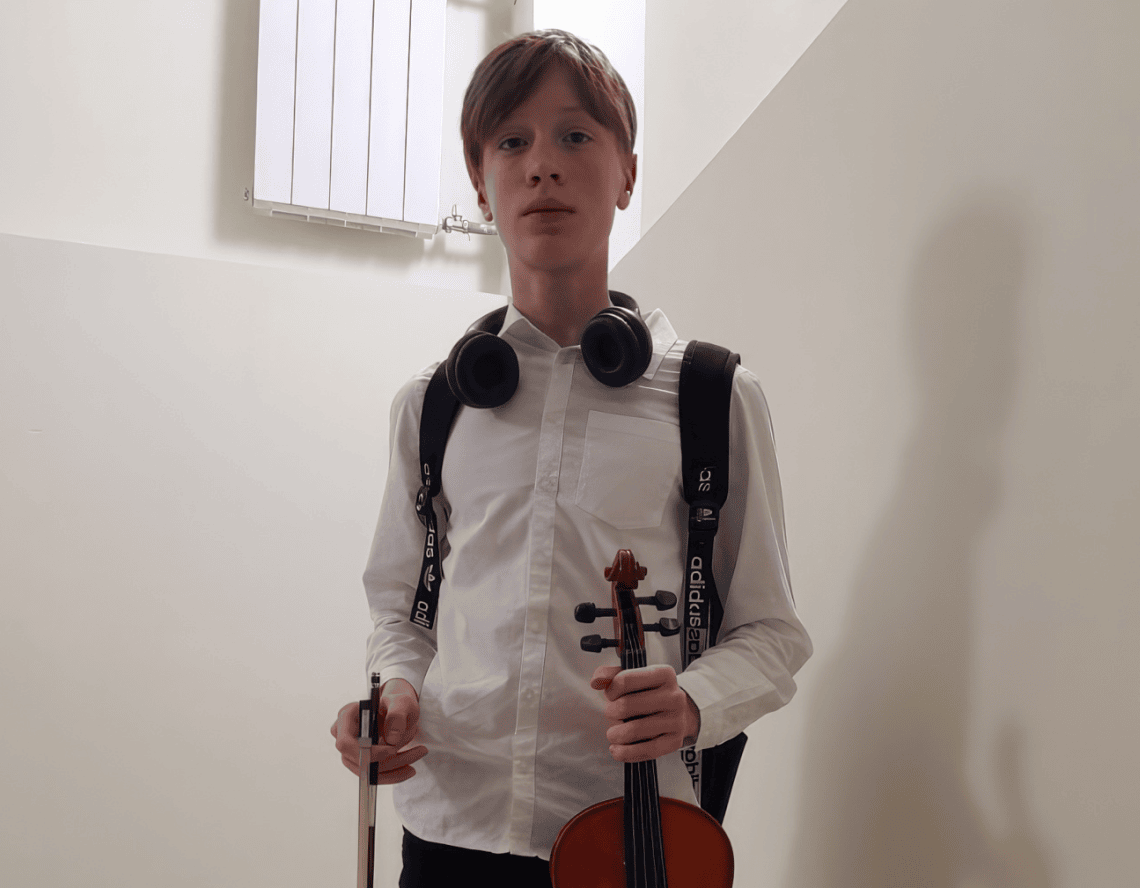 Sviatoslav is getting ready to play the violin